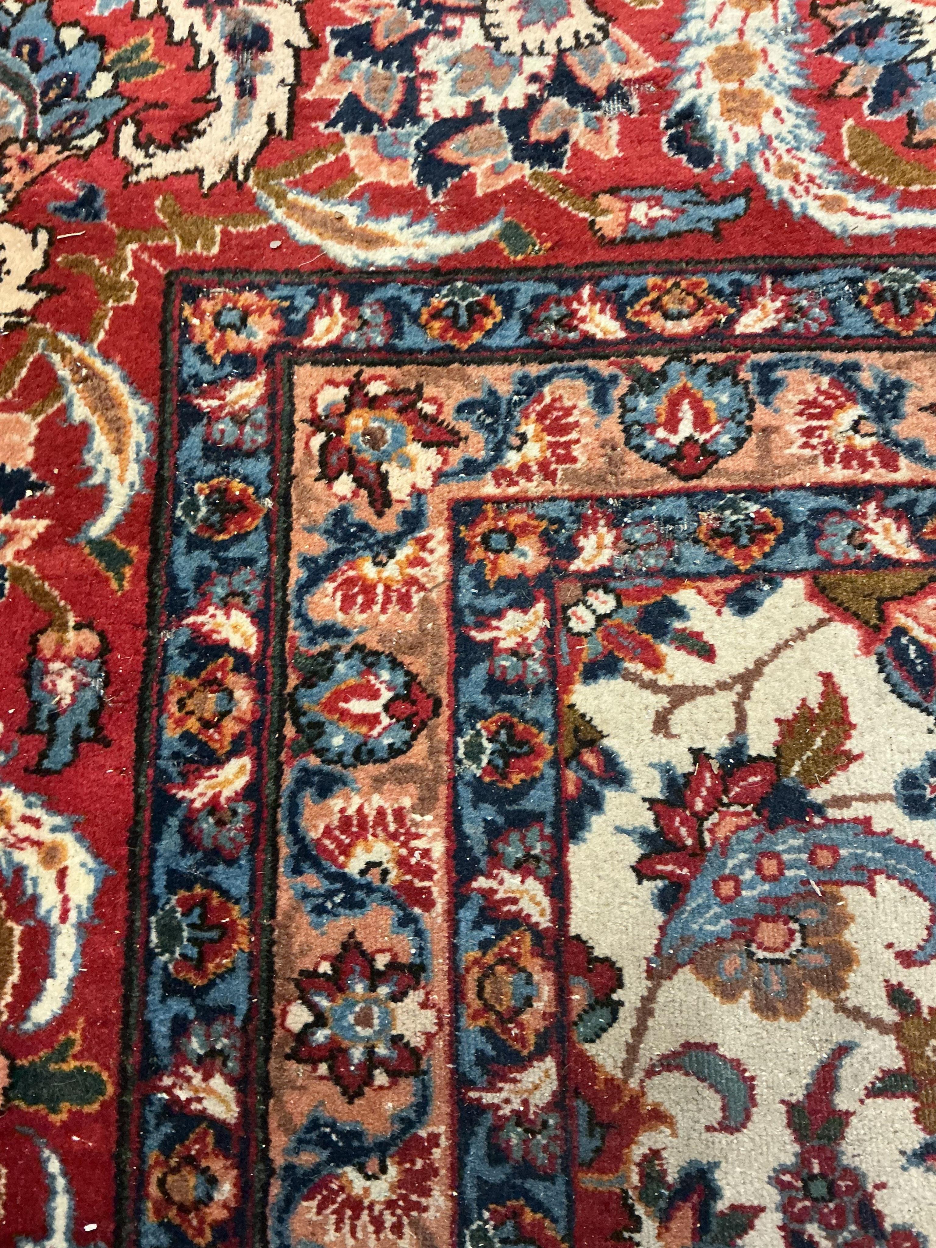 A North West Persian ivory ground floral carpet, 350 x 254cm